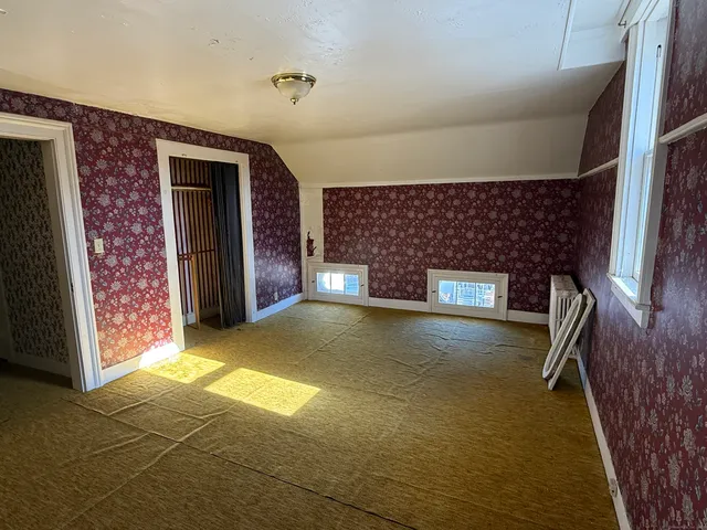a view of a livingroom with wooden floor