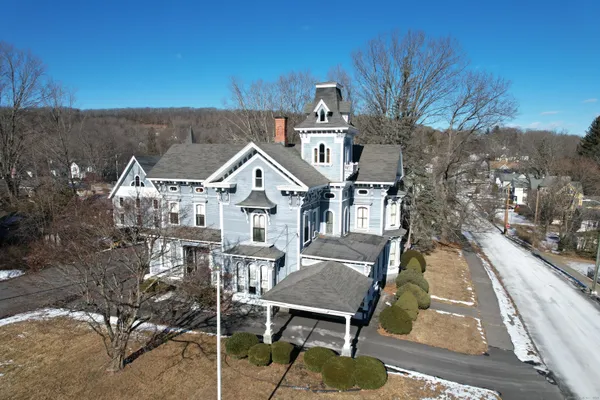 a view of a house with pool table and chairs