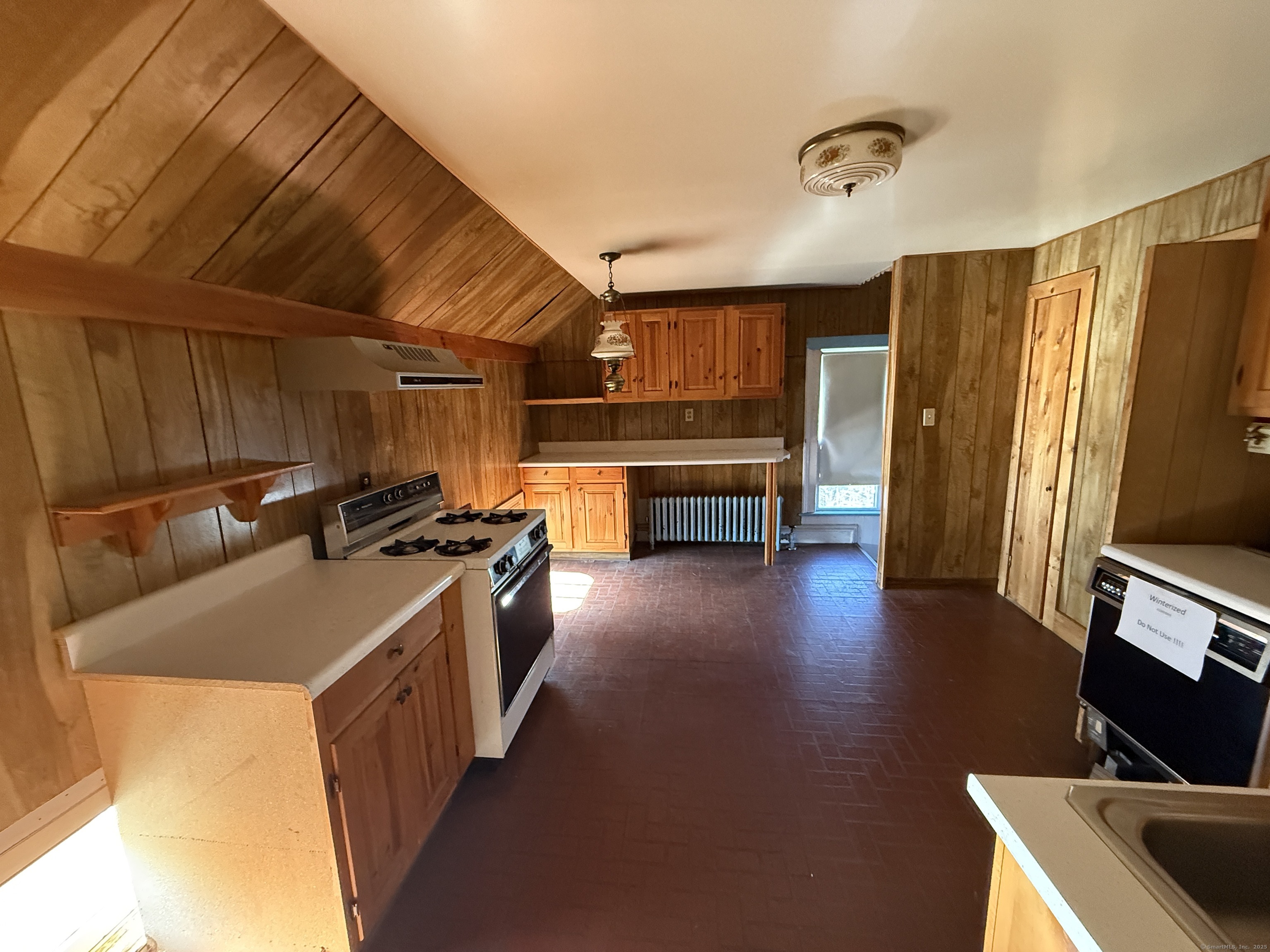 55 Walnut Street Winchester, CT 06098 - Photo 31 of 37 a kitchen with stainless steel appliances granite countertop a sink stove and refrigerator