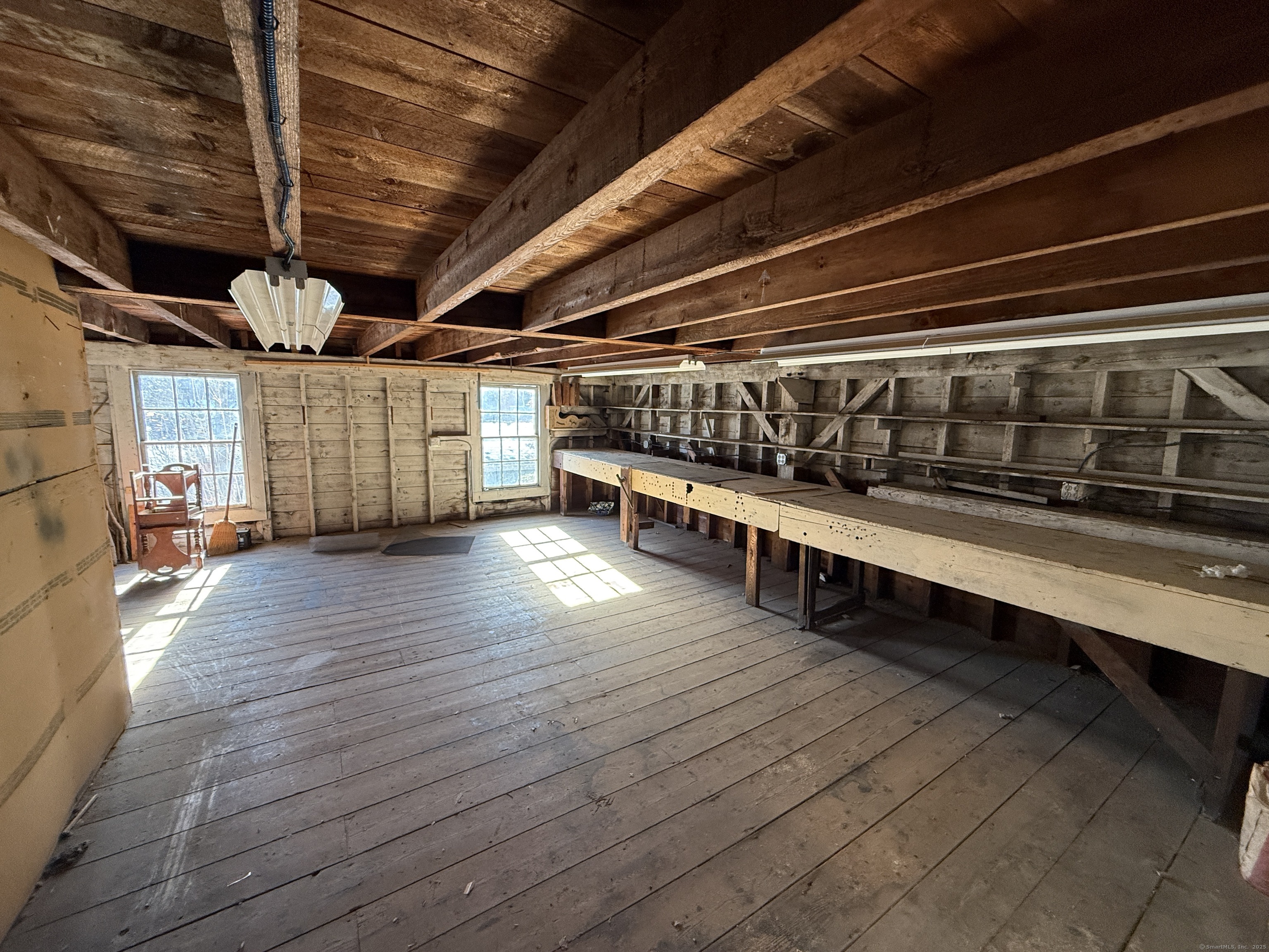 55 Walnut Street Winchester, CT 06098 - Photo 34 of 37 a view of an empty room with wooden floor