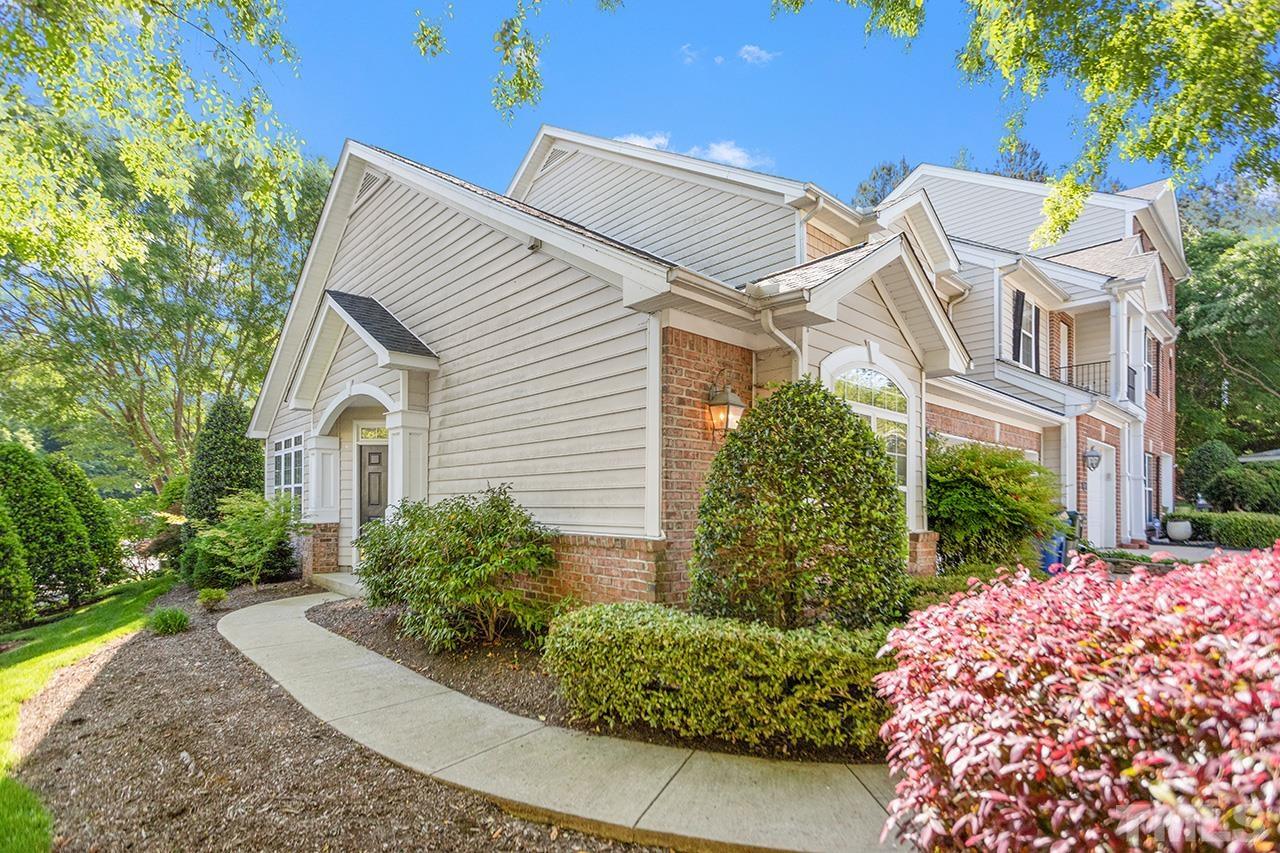 1401 Basinger Court Raleigh, NC 27612 - Photo 2 of 32 a view of a white house with a yard and plants