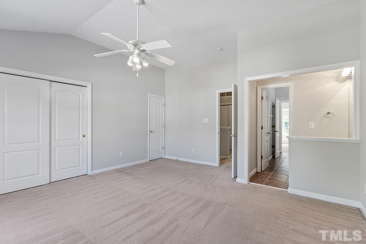 1401 Basinger Court Raleigh, NC 27612 - Photo 28 of 32 a view of an empty room with a ceiling fan