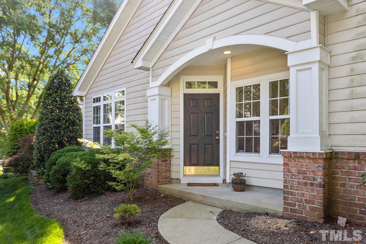 1401 Basinger Court Raleigh, NC 27612 - Photo 3 of 32 a view of a brick house with plants