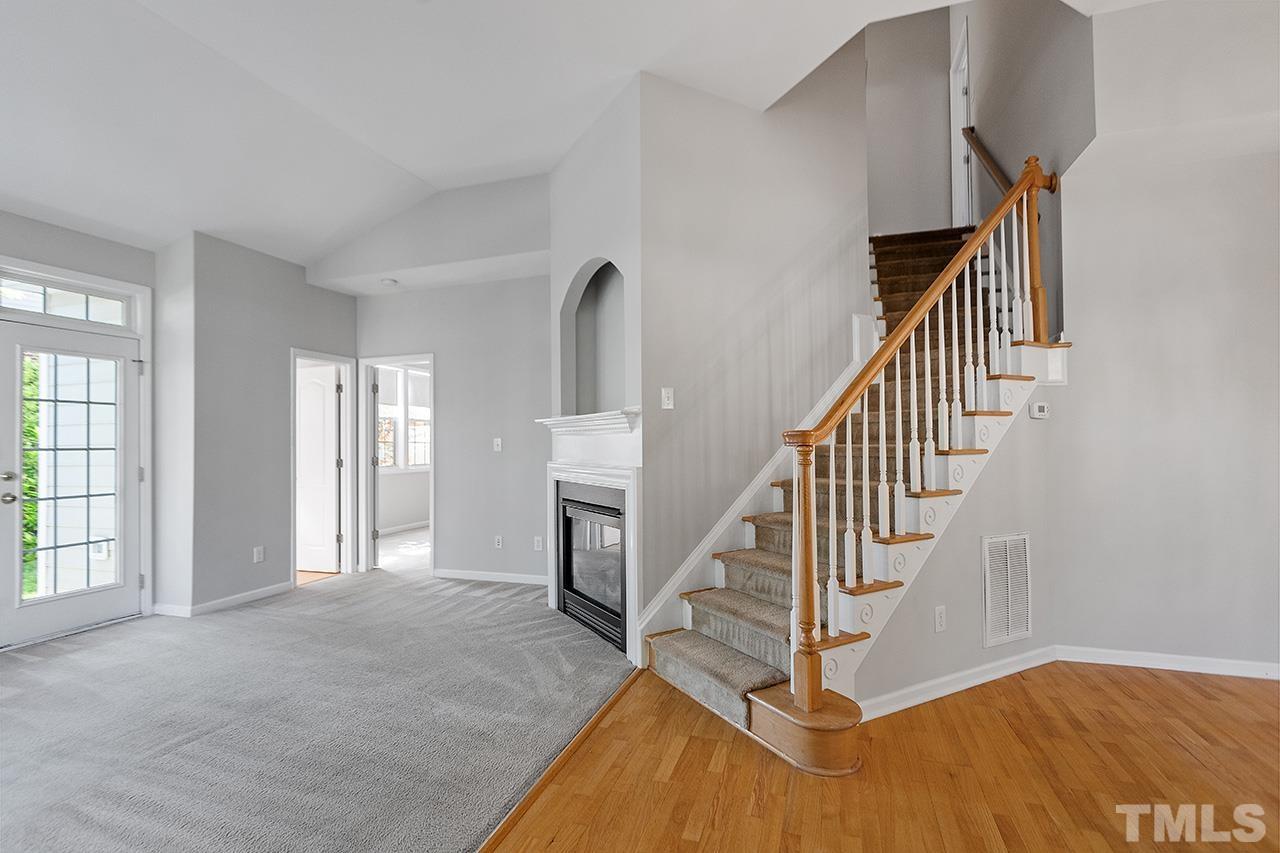 1401 Basinger Court Raleigh, NC 27612 - Photo 6 of 32 a view of entryway and hall with wooden floor