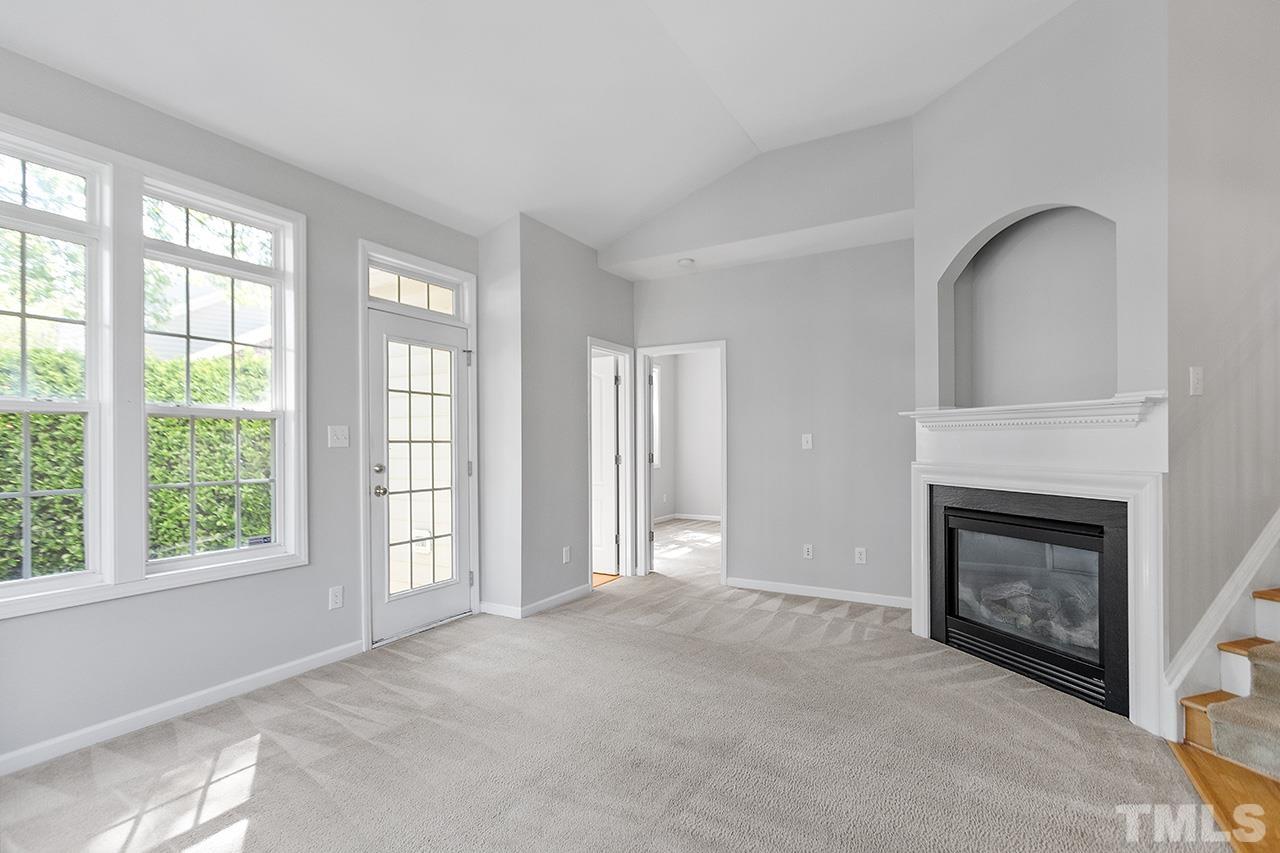1401 Basinger Court Raleigh, NC 27612 - Photo 9 of 32 a view of an empty room with a fireplace