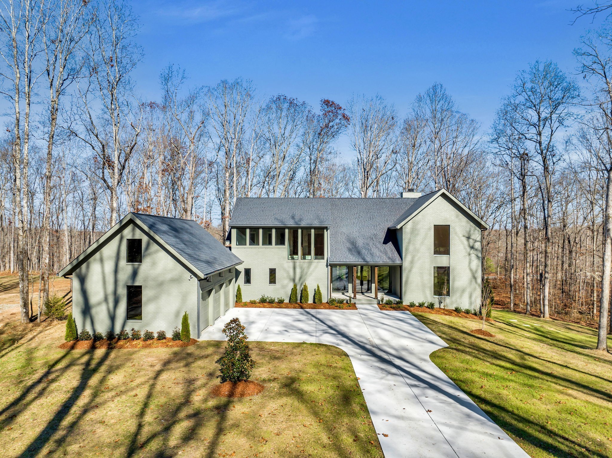 5896 Pinewood Road Franklin, TN 37064 - Photo 1 of 66 a view of a house with a yard covered in snow