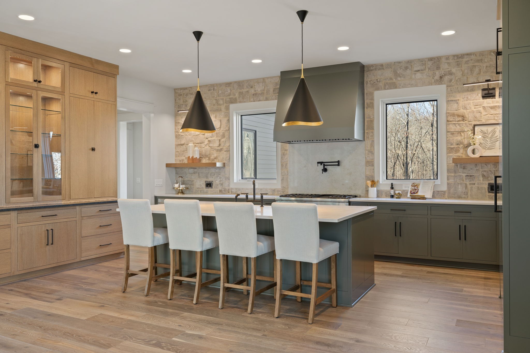 5896 Pinewood Road Franklin, TN 37064 - Photo 18 of 66 a kitchen with stainless steel appliances kitchen island granite countertop a table chairs sink and cabinets