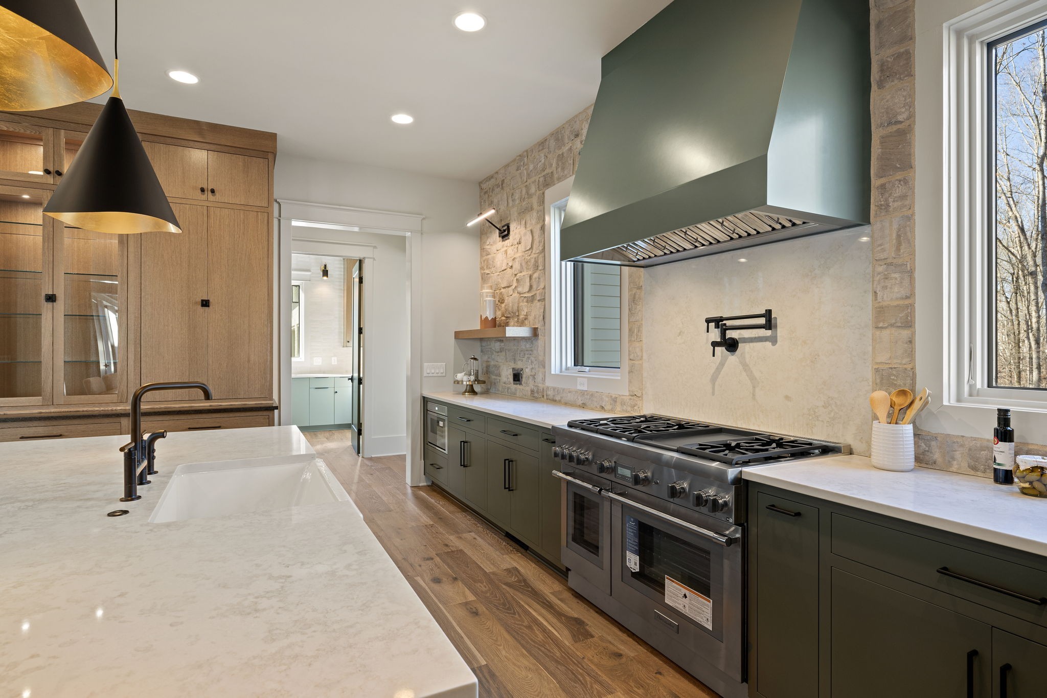 5896 Pinewood Road Franklin, TN 37064 - Photo 21 of 66 a kitchen with stainless steel appliances a sink and a stove