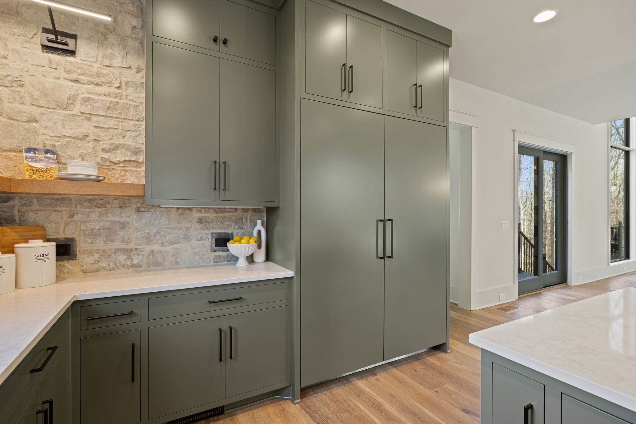 5896 Pinewood Road Franklin, TN 37064 - Photo 23 of 66 a kitchen with cabinets and wooden floor
