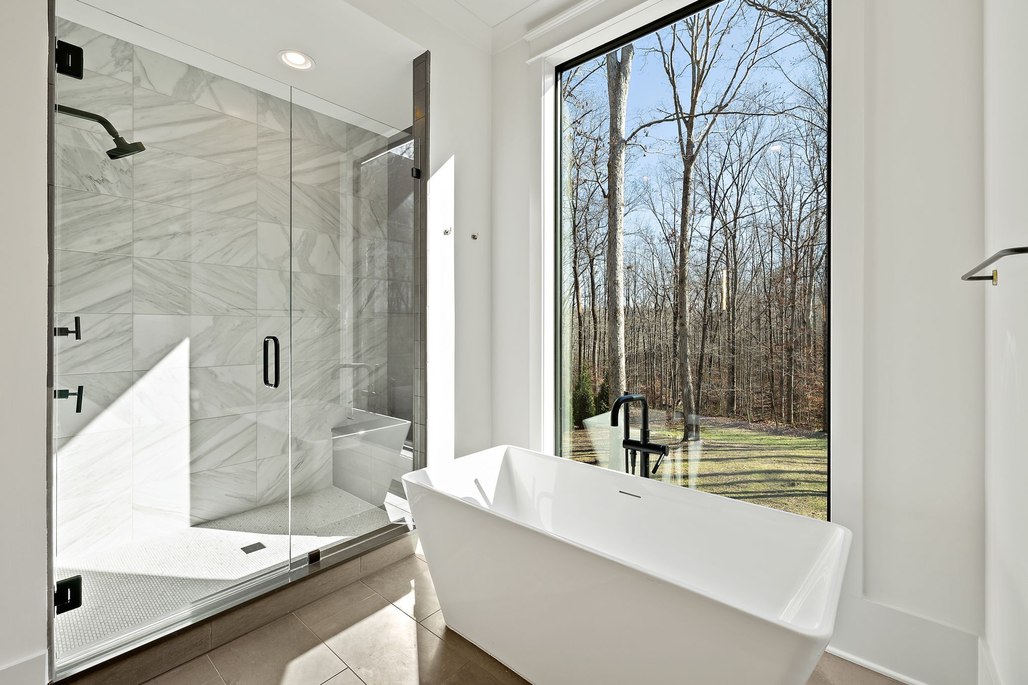 5896 Pinewood Road Franklin, TN 37064 - Photo 38 of 66 a bathroom with a tub and a shower