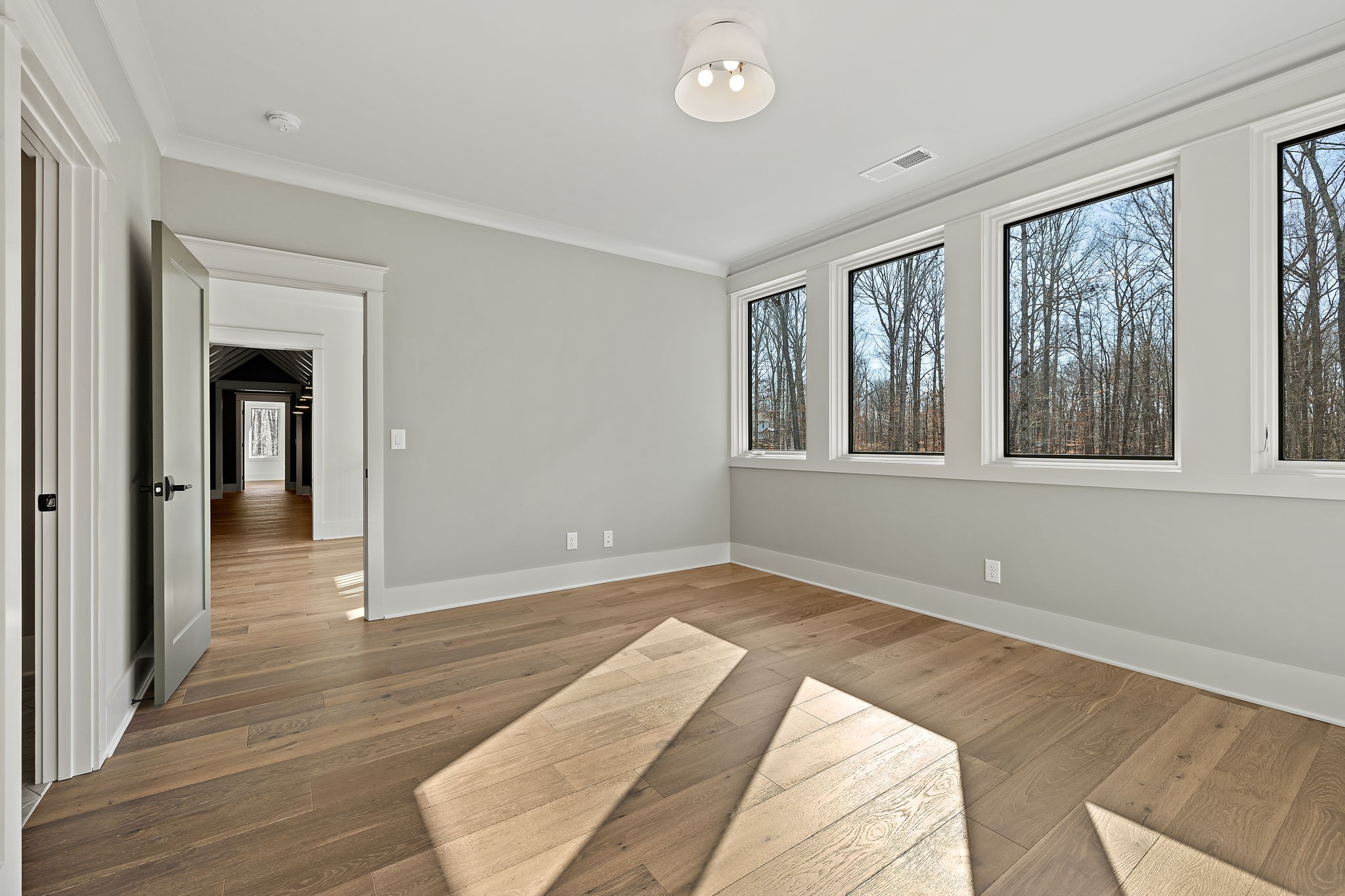 5896 Pinewood Road Franklin, TN 37064 - Photo 45 of 66 a view of an empty room with wooden floor and a window