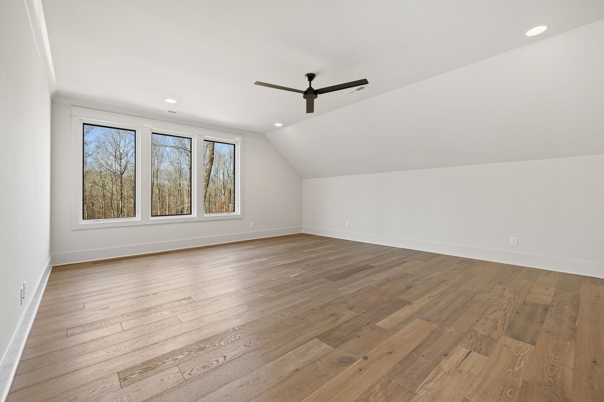 5896 Pinewood Road Franklin, TN 37064 - Photo 48 of 66 an empty room with wooden floor and windows