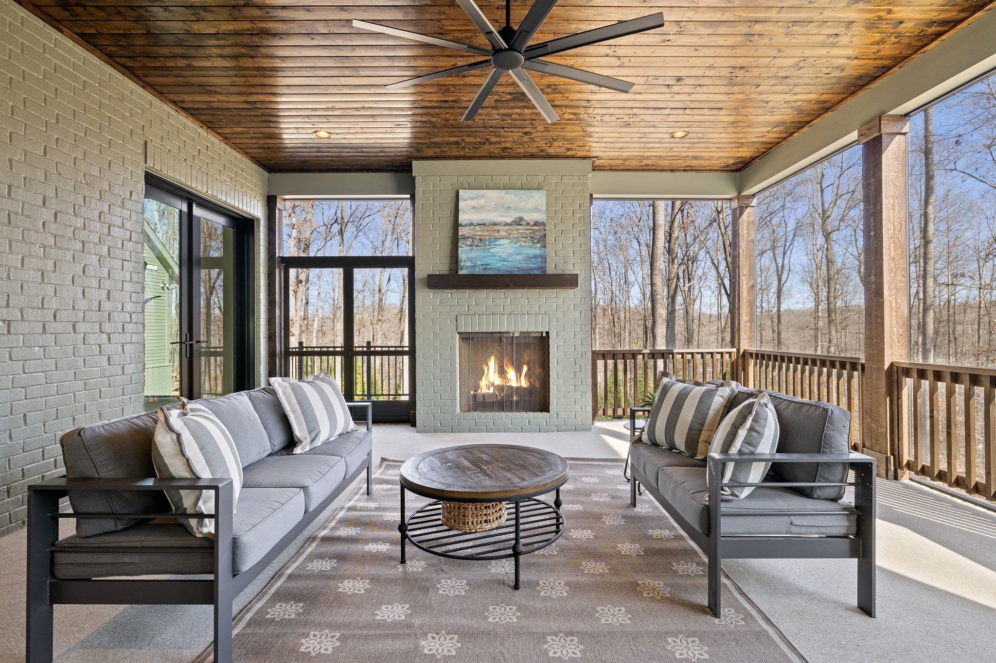5896 Pinewood Road Franklin, TN 37064 - Photo 57 of 66 a living room with furniture a flat screen tv and a large window