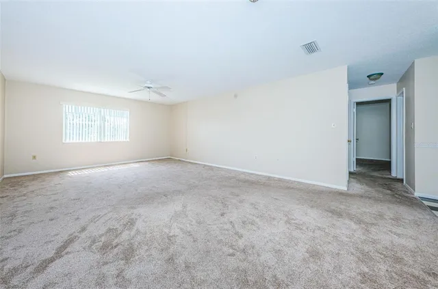 a view of an empty room with a window