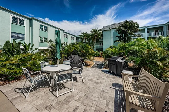 a view of an chairs and tables in patio