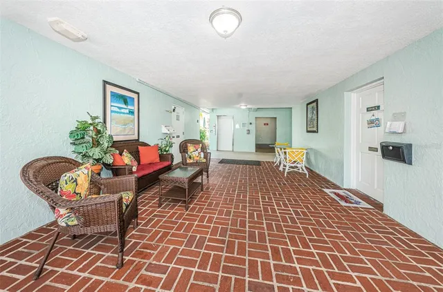 a living room with furniture and flowers