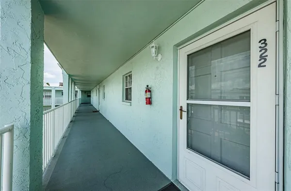 a view of a hallway with white walls