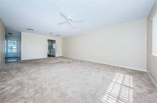 a view of an empty room and a window