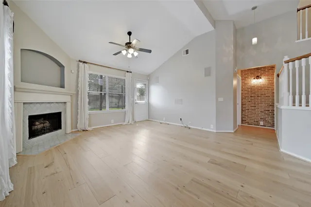 a view of a hallway with entryway and chandelier