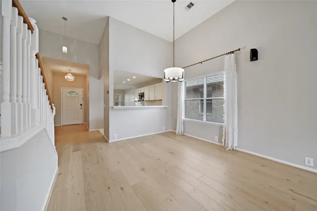 a view of an empty room with windows