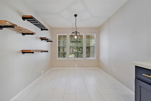a large bathroom with a granite countertop sink a mirror and a vanity