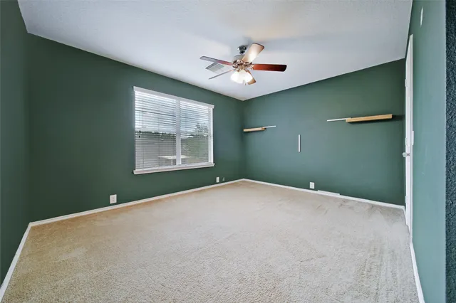 a bathroom with a granite countertop sink vanity and mirror