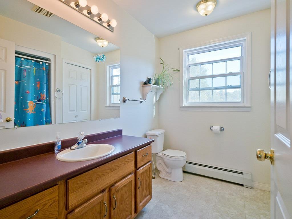 13 Montgomery Road Windham, ME 04062 - Photo 21 of 26 2nd floor bathroom with large mirror.