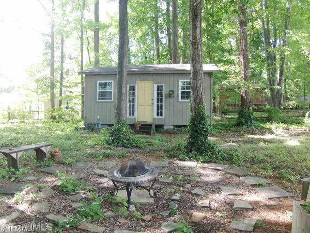 3205 Pine Needles Road High Point, NC 27265 - Photo 15 of 16 Land. Here you see a neat firepit/seating area and the wired storage building, there is a second storage building...