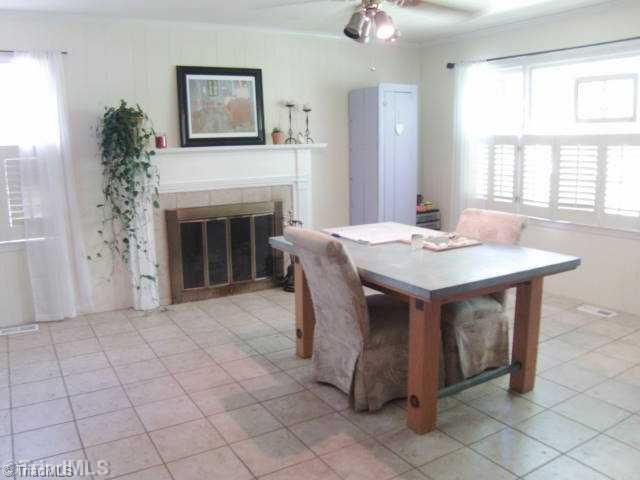 3205 Pine Needles Road High Point, NC 27265 - Photo 7 of 16 Den/Family/Great Room. This is the Family Room off the kitchen note another fireplace in this room, large room with tile flooring, plus there is a 1/2 bath off this room