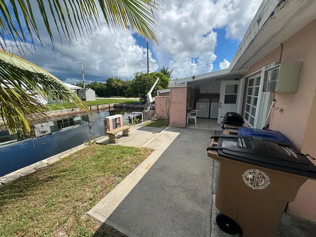 a view of backyard with sitting area