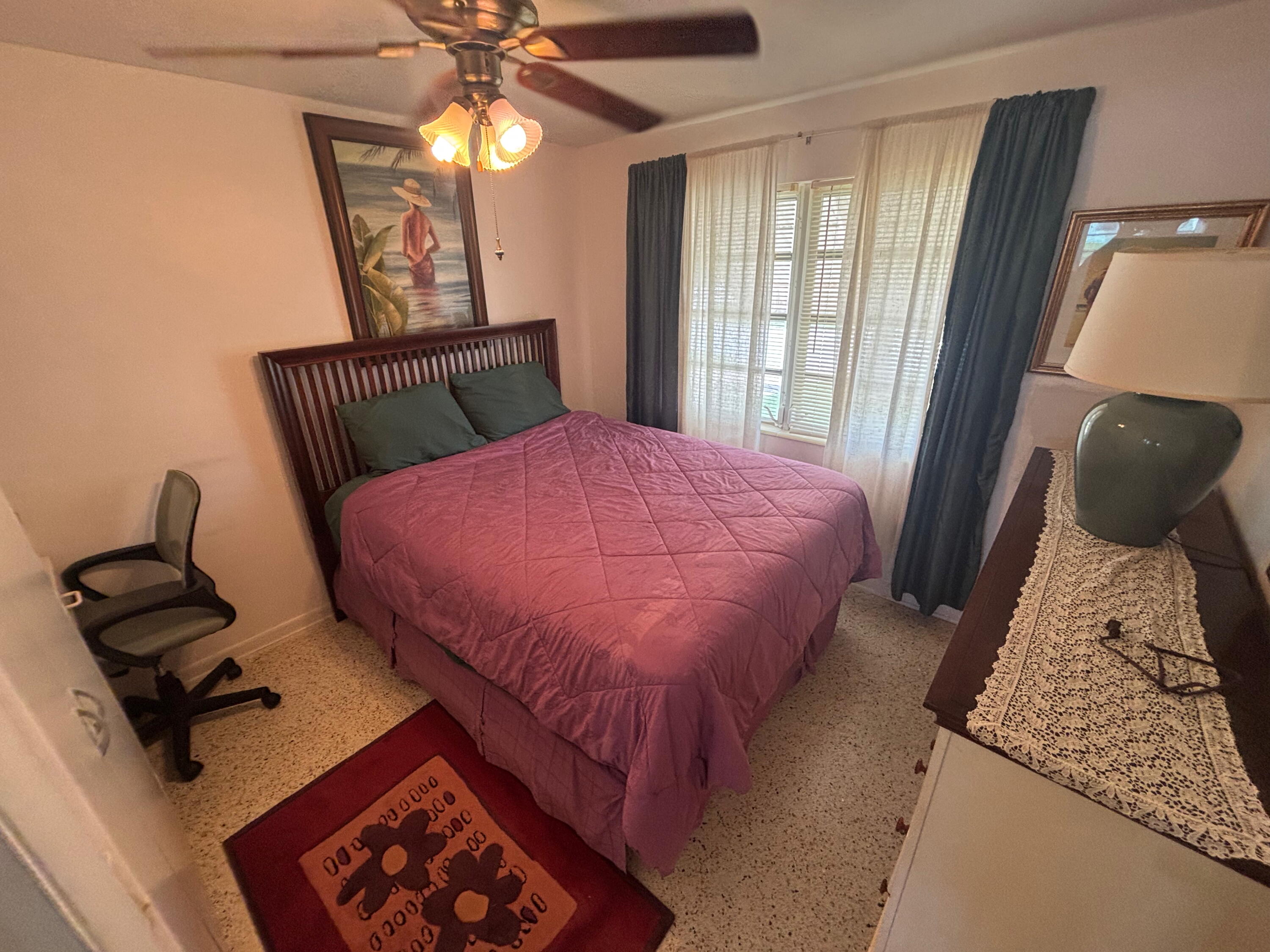 1433 Sunset Road Big Pine Key, FL 33043 - Photo 7 of 18 a bedroom with a bed and a window