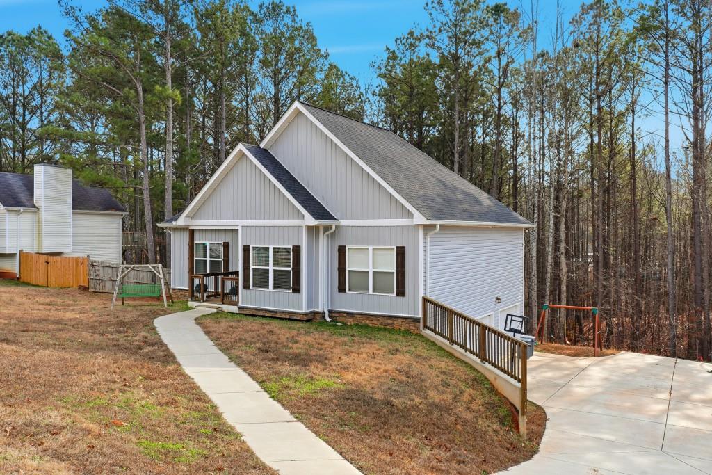 133 Pebblebrook Way Temple, GA 30179 - Photo 2 of 36 a view of a house with a yard covered in snow
