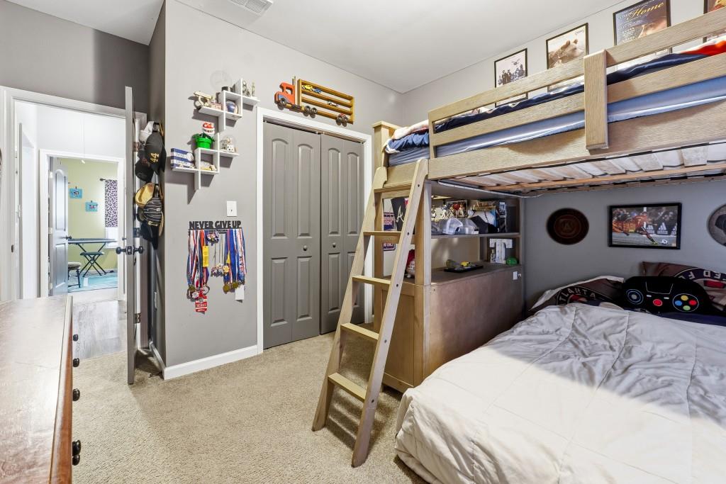 133 Pebblebrook Way Temple, GA 30179 - Photo 21 of 36 a bedroom with a bed and a mirror on the dresser
