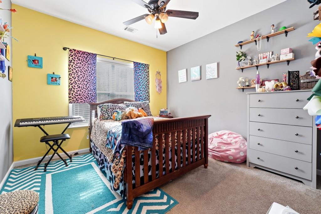 133 Pebblebrook Way Temple, GA 30179 - Photo 22 of 36 a bedroom with a bed and a dresser in it