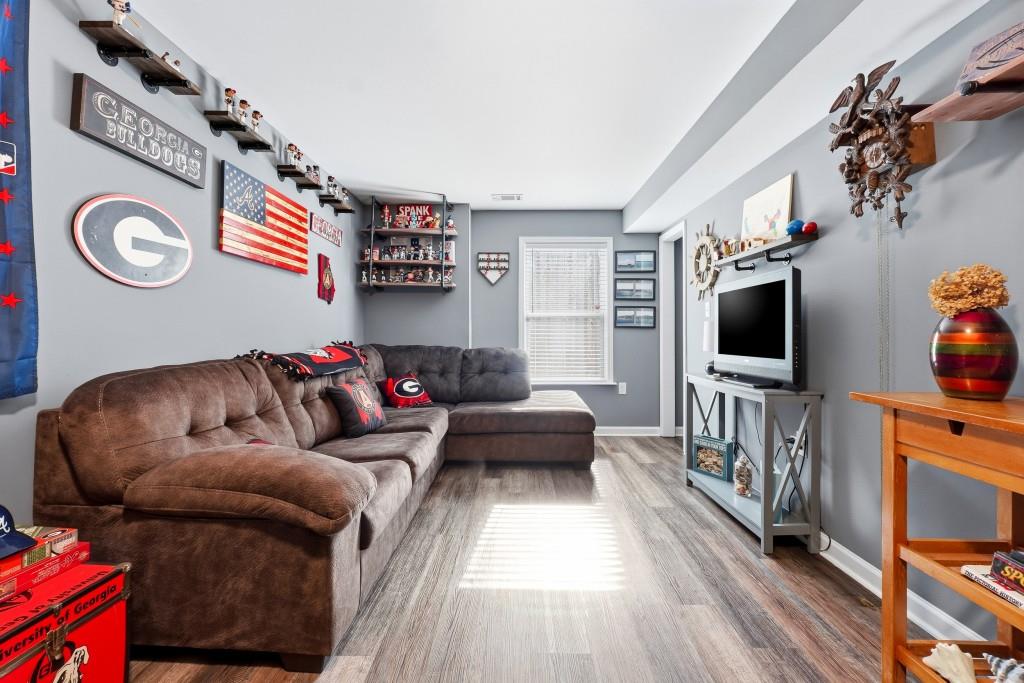 133 Pebblebrook Way Temple, GA 30179 - Photo 26 of 36 a living room with furniture and a flat screen tv