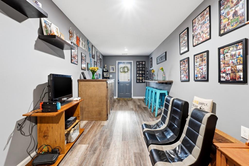 133 Pebblebrook Way Temple, GA 30179 - Photo 28 of 36 a view of a workspace with furniture and wooden floor