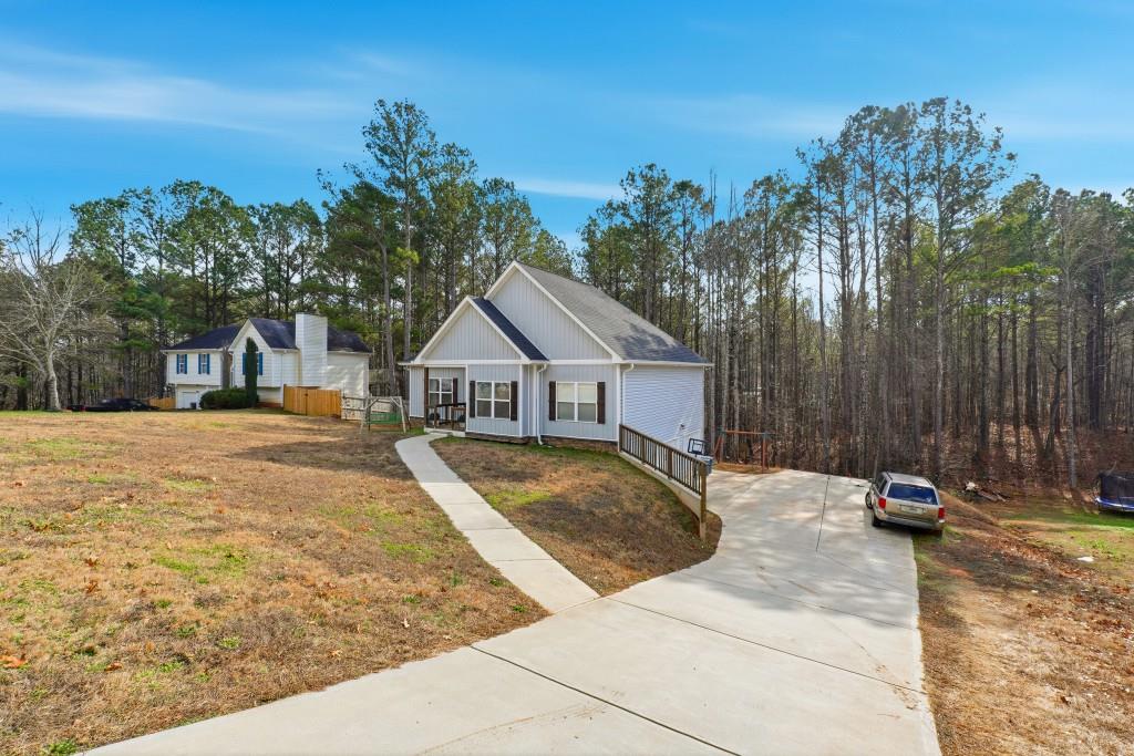 133 Pebblebrook Way Temple, GA 30179 - Photo 35 of 36 a view of a house with backyard and trees