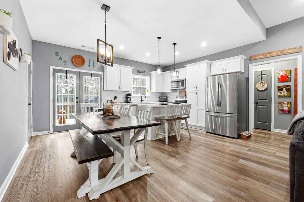 133 Pebblebrook Way Temple, GA 30179 - Photo 8 of 36 a view of a dining room with furniture window and wooden floor