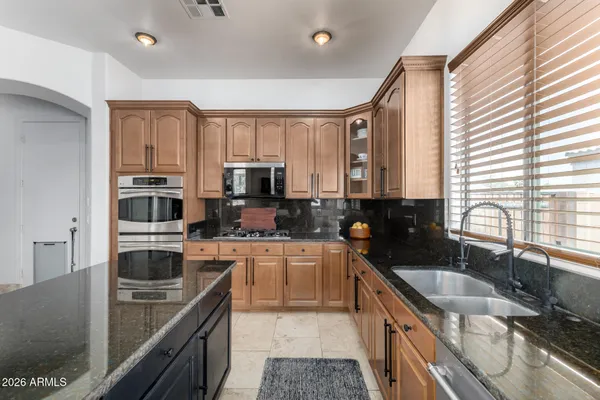 a white toilet sitting next to a bath tub