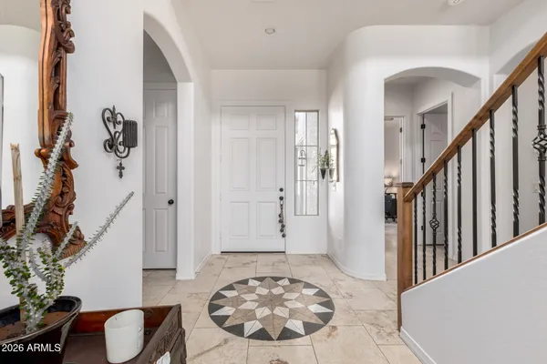 a view of a livingroom with furniture and entryway