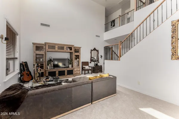 a kitchen with sink cabinets and living room