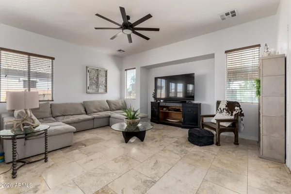 a large kitchen with lots of counter space and dining table