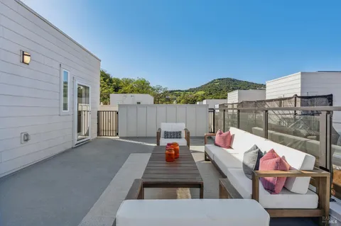 a outdoor living space with furniture and city view