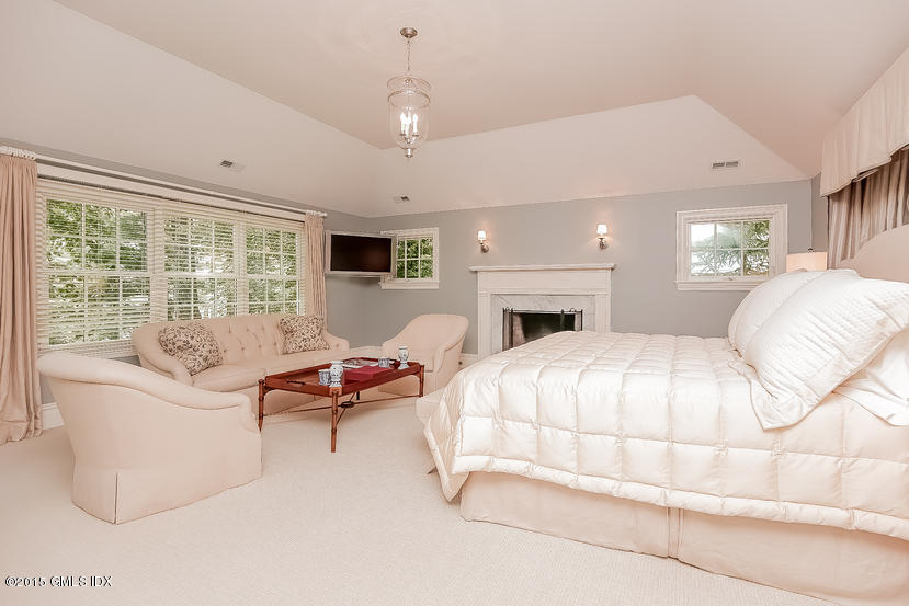 42 Owenoke Way Riverside, CT 06878 - Photo 11 of 19 a bedroom with bed and a large window