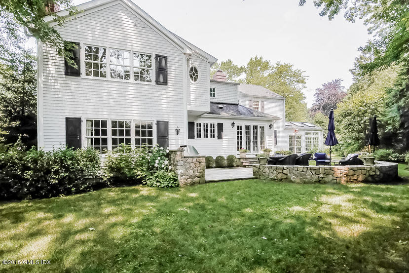 42 Owenoke Way Riverside, CT 06878 - Photo 19 of 19 a view of a house with backyard sitting area and garden