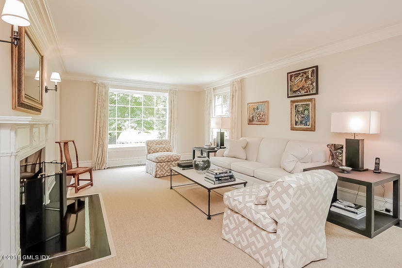 42 Owenoke Way Riverside, CT 06878 - Photo 3 of 19 a living room with furniture a large window and a flat screen tv