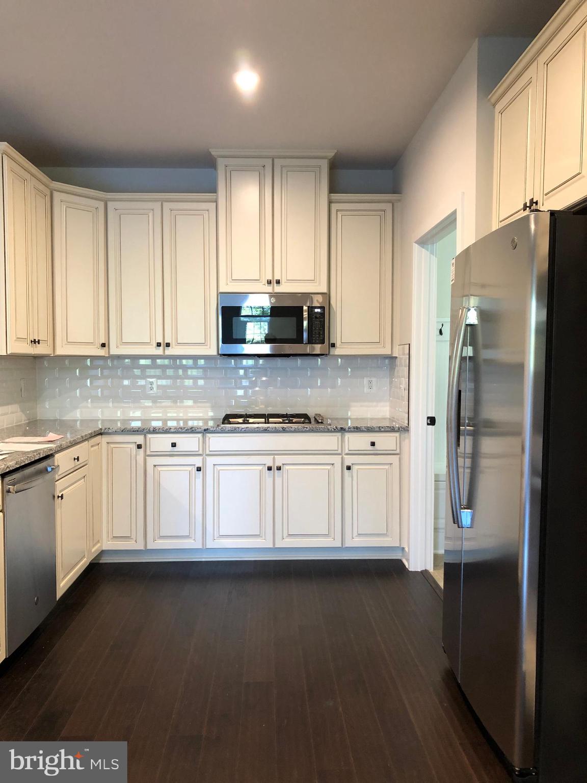 18172 Red Mulberry Road Dumfries, VA 22026 - Photo 3 of 6 Kitchen features double ovens and cooktop