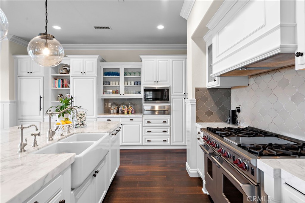 15 Starlight Ladera Ranch, CA 92694 - Photo 8 of 36 a kitchen with stainless steel appliances a stove a sink and a refrigerator