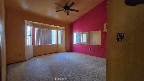 a view of empty room with windows