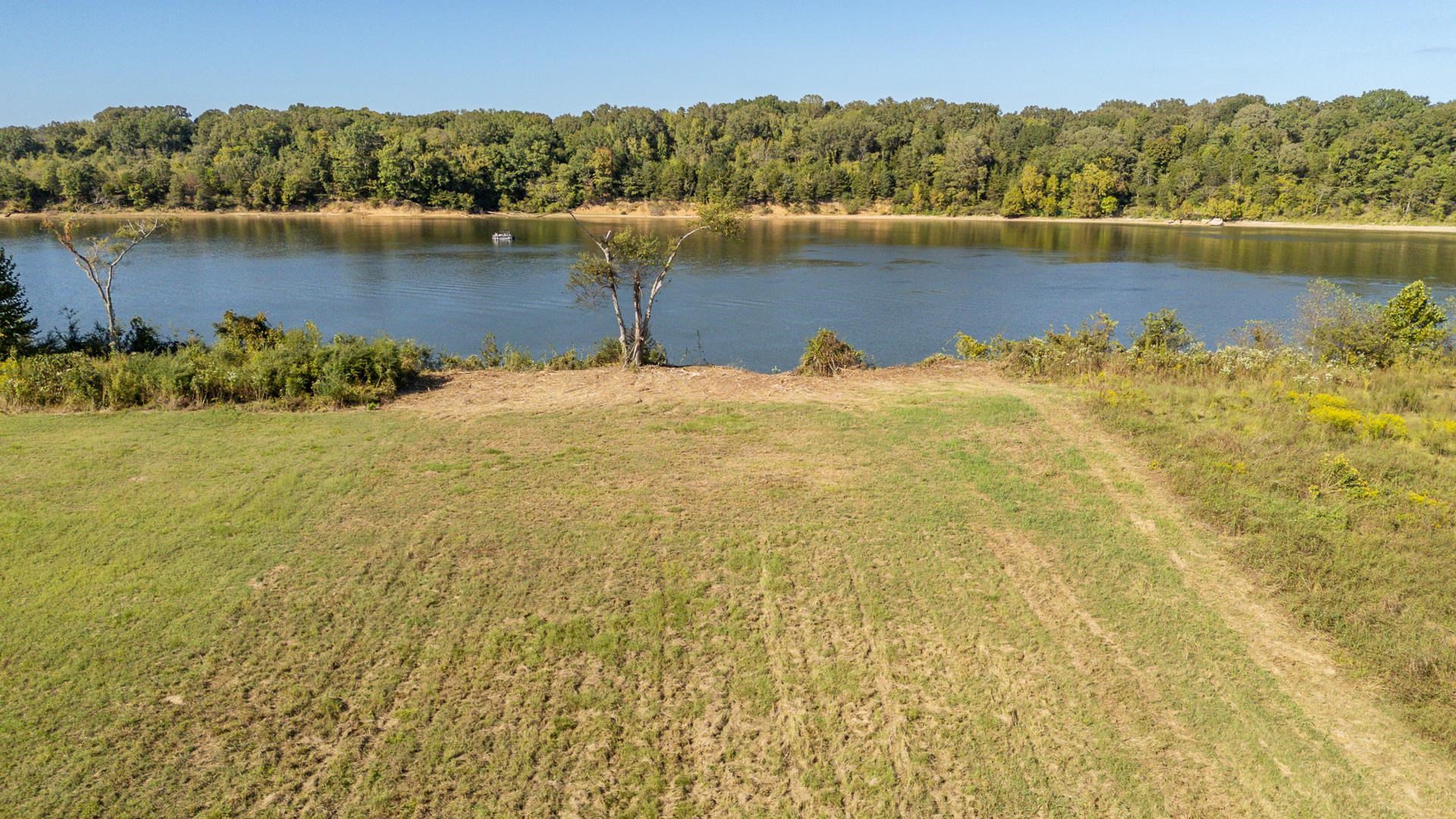 Lot 74 Cravens Road Savannah, TN 38372 - Photo 27 of 39 a view of a lake with a mountain in the background